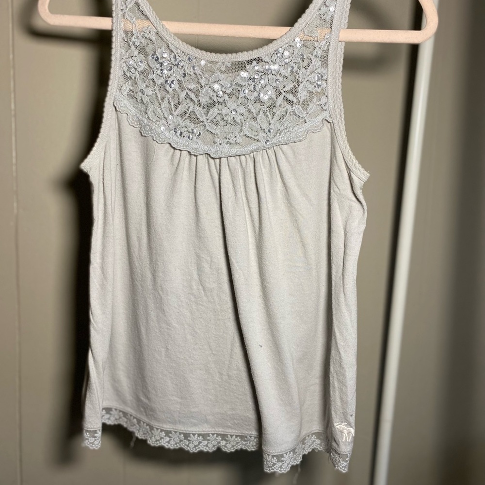 Light grey top with floral lace & sequin detailing on the colar.